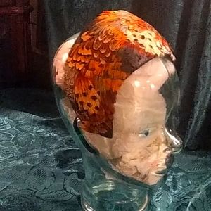 Vintage 1920s or 30's hat with golden pheasent feathers.